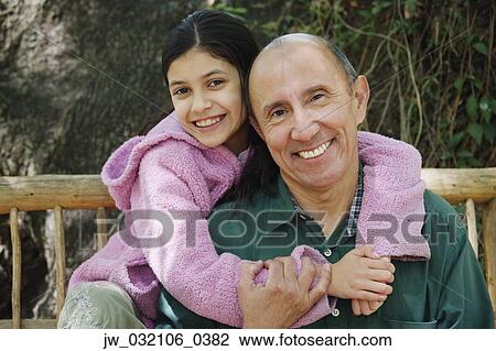 Stock Photo of Hispanic grandfather and granddaughter ...