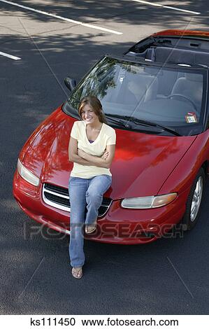 Types Of Car Insurance >> Stock Photography of Woman sitting on car hood, portrait, aerial angle ks111450 - Search Stock ... Types Of Car Insurance >> Stock Photography of Woman sitting on car hood, portrait, aerial angle ks111450 - Search Stock ...