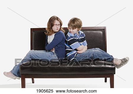 Stock Image - sibling rivalry; edmonton, alberta, canada. Fotosearch - Search Stock Photos, Mural Pictures, Photographs, and Photo Clipart