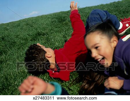 Stock Photography Of Children Play Ring-around-the-rosy And Fall Down 