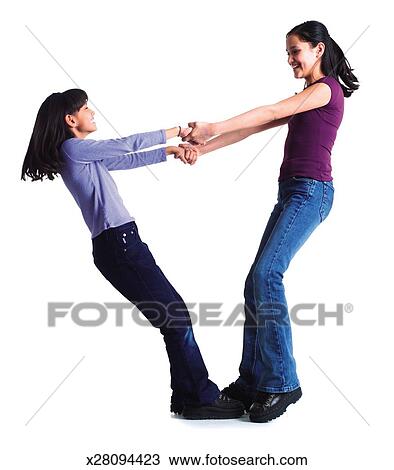 Stock Photo of two young ethnic looking sisters hold each ...