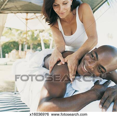 Masseur+Search Image - Female Masseur Giving a Man a Massage. Fotosearch - Search ...