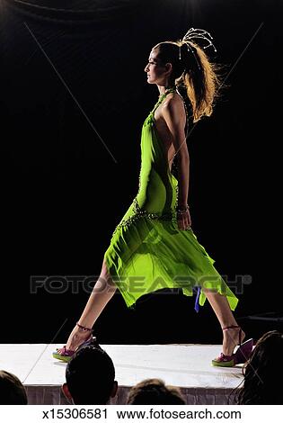 Fashion Model Walking On Catwalk During Show Side View Fashion Model Walking On Catwalk During Show Side View