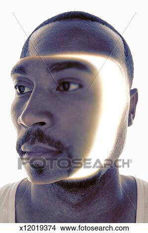 Young man with light emanating from <b>head (Digital</b> Composite) - x12019374