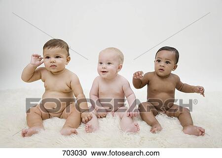 Stock Photography Of Three Naked Babies Sitting In A Row 703030