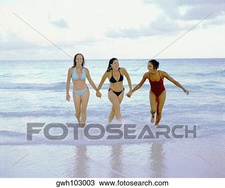Stock Photo Of Three Young Women Walking And Holding Hands On - 450x377 - jpeg People Holding Hands Walking