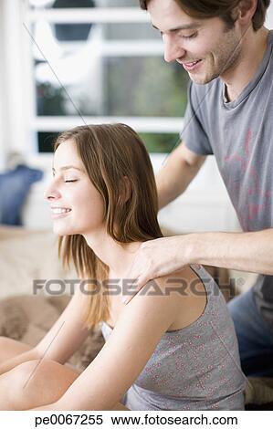 Stock Image of Husband giving wife massage pe0067