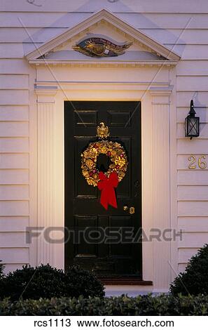 Christmas Front Door Clipart stock photo of spot lit gilded pine cone wreath with a red bow Christmas Front Door Clipart stock photo of spot lit gilded pine cone wreath with a red bow