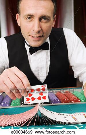 Stock Photograph - Card dealer doing a trick. Fotosearch - Search Stock Photography, Posters - e00004659