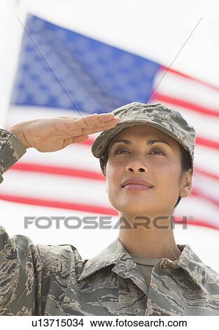 Stock Photo Of Female Army Soldier Saluting American Flag In Stock Photo Of Female Army Soldier Saluting American Flag In