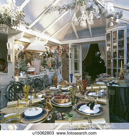 Stock Photo of Conservatory dining room with table decorated for ... Stock Photo of Conservatory dining room with table decorated for ...