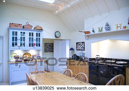 Black And White Country Kitchen stock image of old pine table and chairs in white country kitchen Black And White Country Kitchen stock image of old pine table and chairs in white country kitchen
