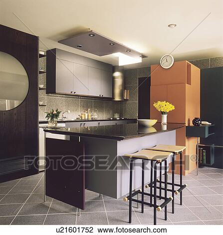 Stock foto black, metaal, en, hout, krukken, op, grijze, eiland ...
