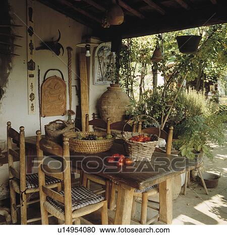 Rustic Wooden Furniture On Veranda Of Italian Country House Rustic Wooden Furniture On Veranda Of Italian Country House