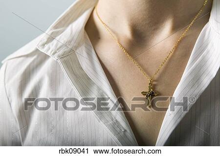 cross wearing necklace woman fotosearch