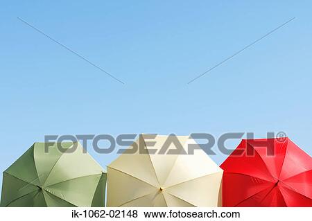 3 different colored umbrellas cropped View Large Photo Image Stock Photo - 3 different colored umbrellas cropped. Fotosearch
