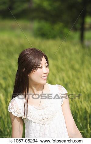 Picture - A young woman smiling. Fotosearch