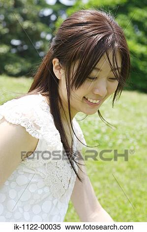 Stock Photography - A young woman smiling. Fotosearch