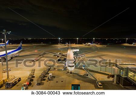 Airplanes parked in hangar at airport View Large Photo Image Stock Image - Airplanes parked in hangar at airport. Fotosearch