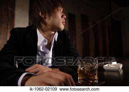 Angled photograph of Japanese man with ashtray and scotch-whiskey View Large Photo Image Stock Photo - Angled photograph of Japanese man with ashtray and scotch-whiskey. Fotosearch