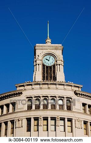 Stock Photo - Architectural building with windows and clock tower. Fotosearch