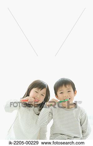 Stock Photo - Asian brother and sister brushing together. Fotosearch