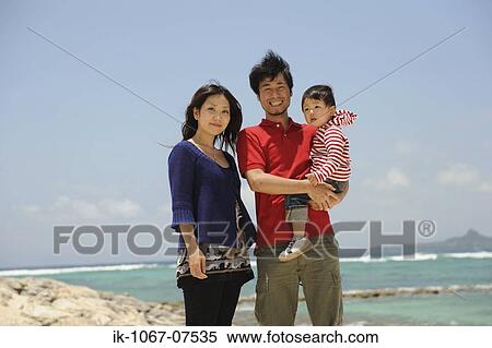 Asian family enjoying on beach View Large Photo Image Stock Photography - Asian family enjoying on beach. Fotosearch