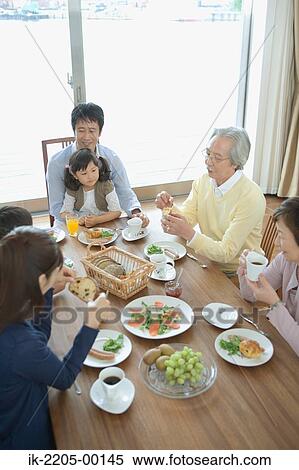 Asian family having breakfast together View Large Photo Image Stock Photography - Asian family having breakfast together. Fotosearch