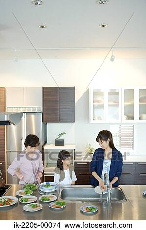 Asian family serving food in plates View Large Photo Image Picture - Asian family serving food in plates. Fotosearch