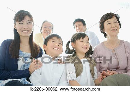 Stock Image - Asian family sitting together. Fotosearch