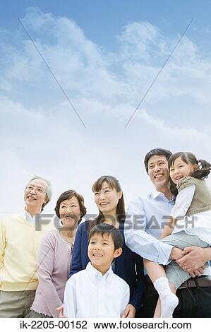 Stock Image - Asian family standing together. Fotosearch