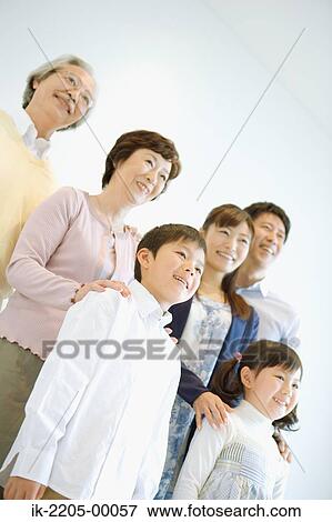 Stock Photo - Asian family standing together. Fotosearch