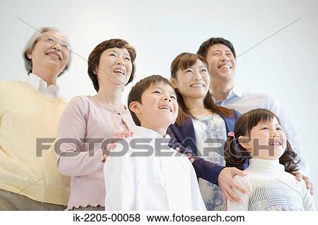 Stock Photo - Asian family standing together. Fotosearch