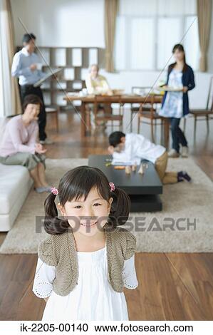 Asian girl smiling and looking at camera View Large Photo Image Stock Image - Asian girl smiling and looking at camera. Fotosearch
