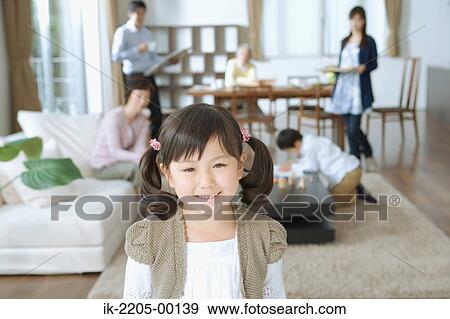 Asian girl smiling and looking at camera View Large Photo Image Stock Photo - Asian girl smiling and looking at camera. Fotosearch
