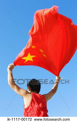 Stock Image - Athlete Holding China's Flag. Fotosearch