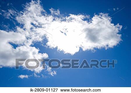 Blue Sky with Fluffy Clouds View Large Photo Image Stock Photo - Blue Sky with Fluffy Clouds. Fotosearch
