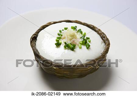 Bowl of garnished pudding in a plate View Large Photo Image Stock Photo - Bowl of garnished pudding in a plate . Fotosearch