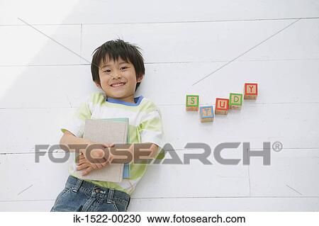 Boy Holding Book View Large Photo Image Stock Image - Boy Holding Book. Fotosearch