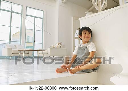 Stock Image - Boy Sitting Down. Fotosearch