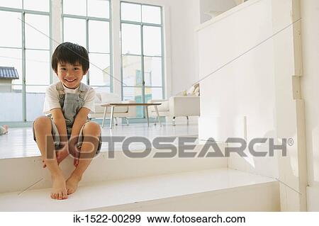 Boy Sitting Down View Large Photo Image Stock Photo - Boy Sitting Down. Fotosearch