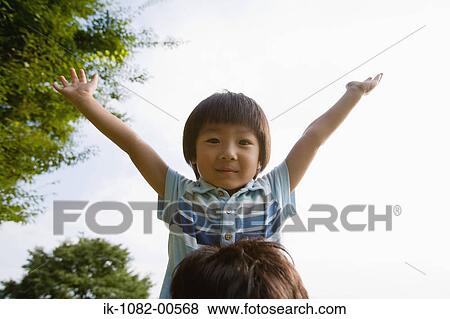 Boy stretching arms and looking at camera View Large Photo Image Stock Photo - Boy stretching arms and looking at camera. Fotosearch