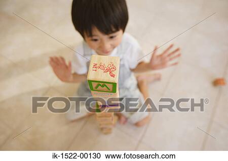 Boy Surprised at Stack of Blocks View Large Photo Image Stock Image - Boy Surprised at Stack of Blocks. Fotosearch