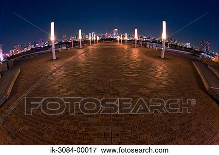 Stock Photo - Bridge illuminating at night. Fotosearch