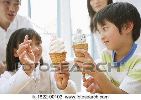 Brother and Sister Holding Ice Cream Cones View Large Photo Image Stock Image - Brother and Sister Holding Ice Cream Cones. Fotosearch