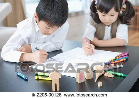 Stock Photograph - Brother and sister painting together. Fotosearch