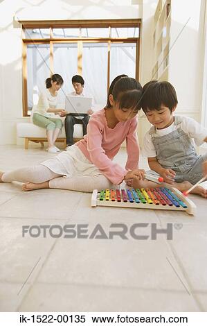 Brother and Sister Playing with Xylophone View Large Photo Image Stock Photography - Brother and Sister Playing with Xylophone. Fotosearch