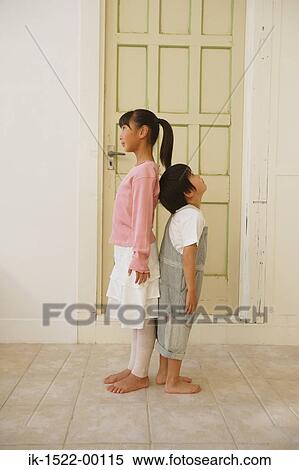 Brother and Sister Standing Back-to-Back View Large Photo Image Stock Photography - Brother and Sister Standing Back-to-Back. Fotosearch