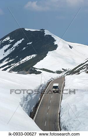 Bus Passing From the Snow Covered Road in Japan View Large Photo Image Stock Photo - Bus Passing From the Snow Covered Road in Japan . Fotosearch
