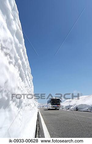 Bus Passing From the Snow Covered Road in Japan View Large Photo Image Stock Photo - Bus Passing From the Snow Covered Road in Japan . Fotosearch